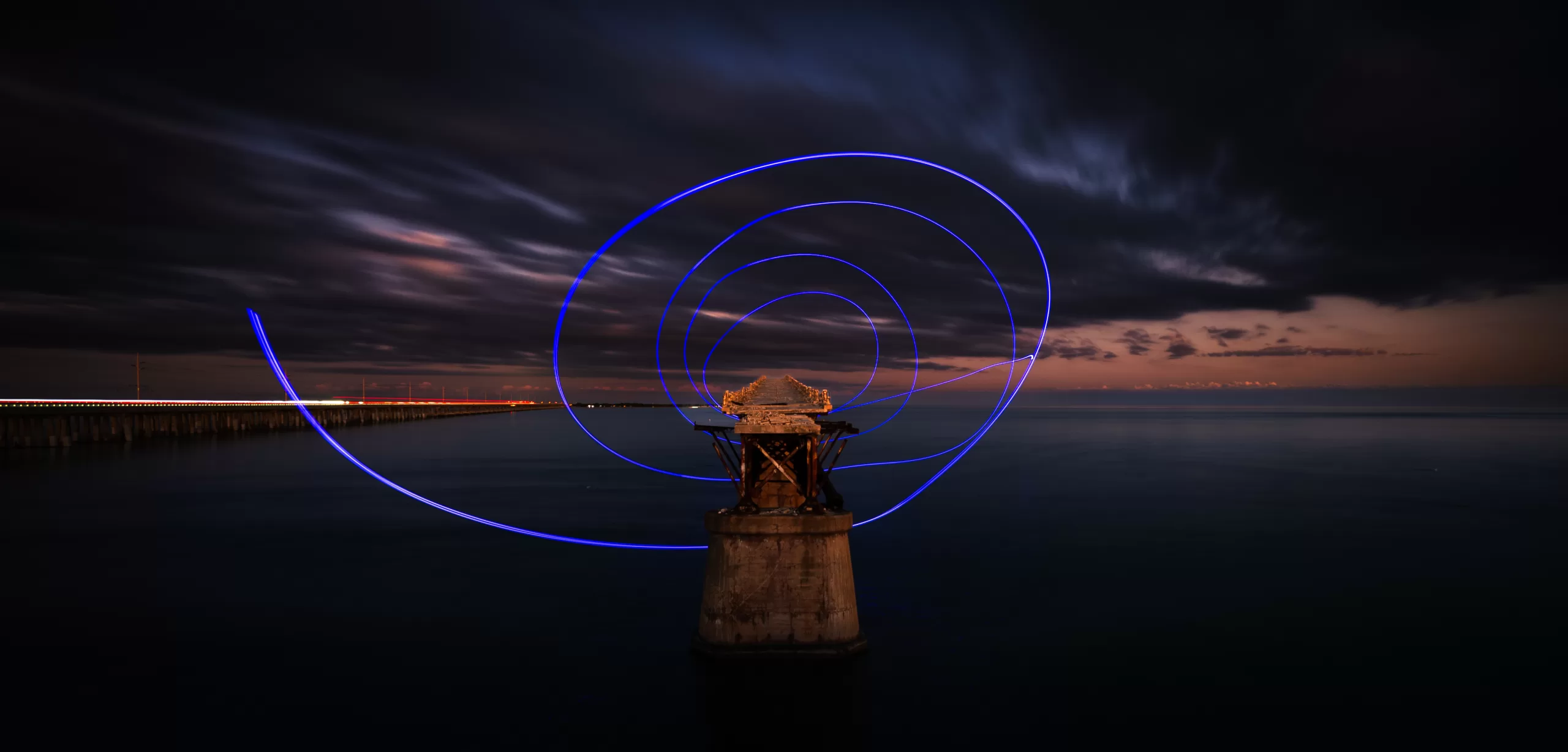 Light painting at the end of a pier at night, Bahia Honda