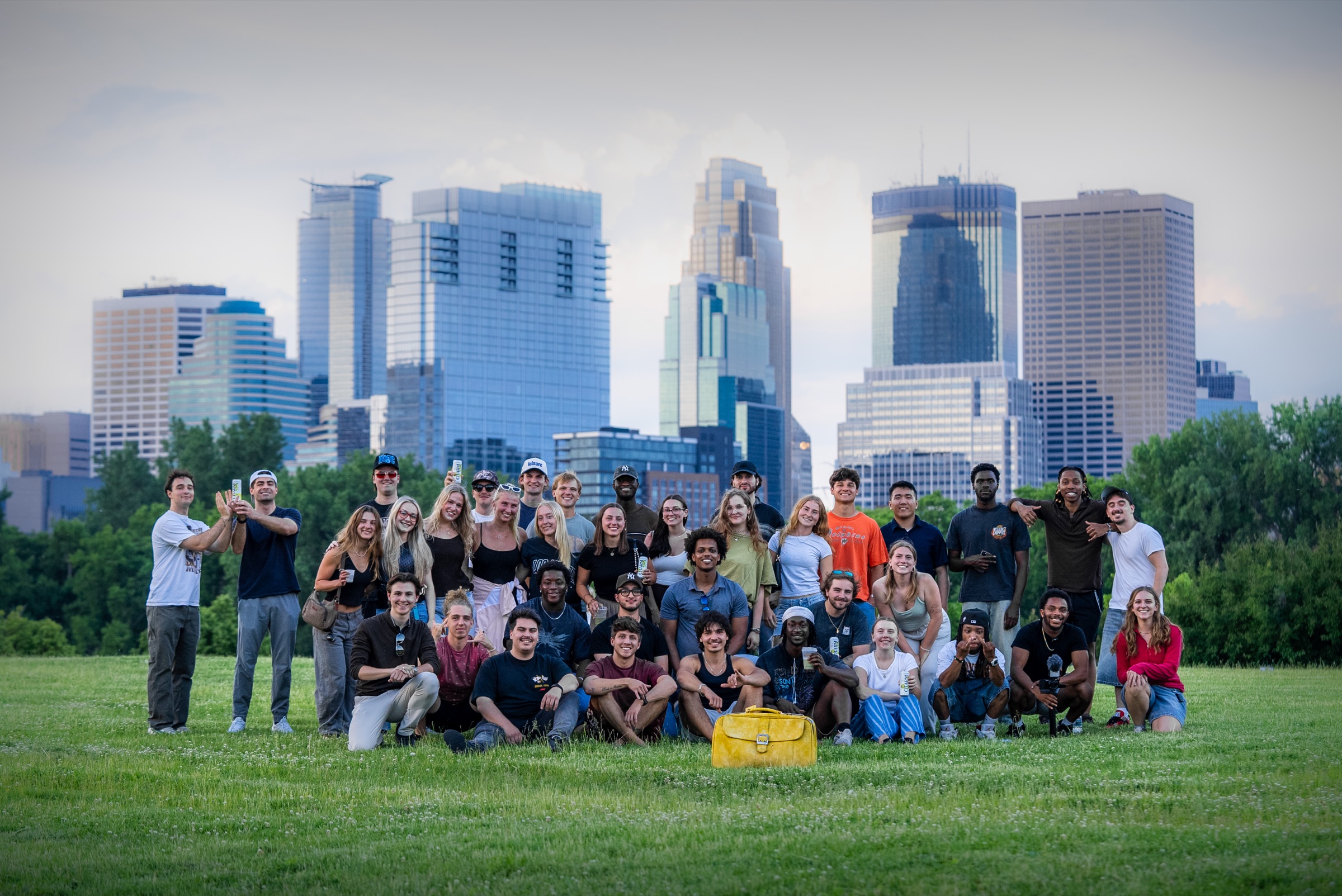 The Kids Like Us meetup crowd in Minneapolis with the yellow suitcase